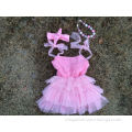 baby girls pink rosette dress with matching headband and chunky necklace and leg warmer set